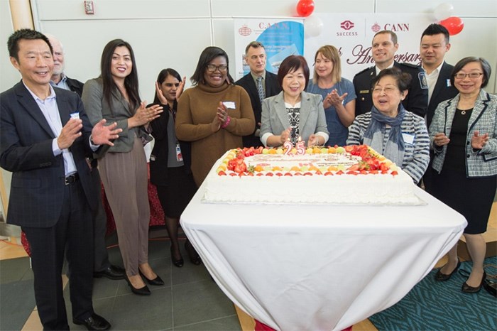  Representatives from IRCC, S.U.C.C.E.S.S., YVR and newcomers who were helped celebrate the Community Airport Newcomers Network anniversary. Photo submitted