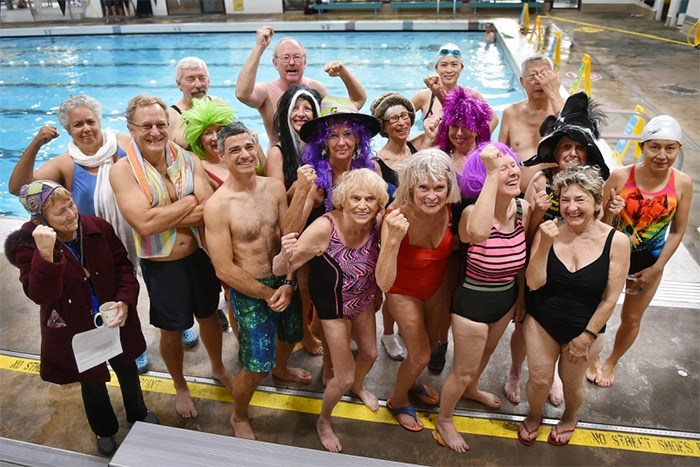  A large group of residents gathered at Lord Byng pool Tuesday morning. The group is upset the current draft of the park board’s plan for aquatic facilities includes demolishing the West Side pool. Photo Dan Toulgoet