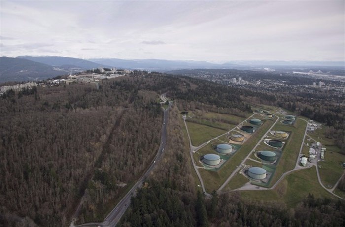  Kinder Morgan Trans Mountain Expansion Project's oil storage tank farm, at right with green tanks, is seen in Burnaby, B.C., on Friday, Nov. 25, 2016. The City of Burnaby wants Saskatchewan's Minister of Justice and Attorney General to reconsider and withdraw comments attributed to him suggesting Burnaby 