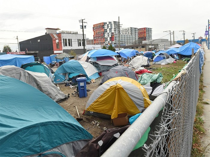  The city announced Wednesday that it wants to open temporary modular housing buildings on two city properties in the Downtown Eastside, including the current site of a homeless camp on Franklin Street. Photo Daniel Toulgoet