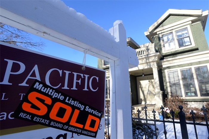  A real estate sold sign is shown outside a house in Vancouver, Tuesday, Jan.3, 2017. British Columbia's housing market continues to power forward even though real estate experts say fewer properties are available for sale. THE CANADIAN PRESS/Jonathan Hayward