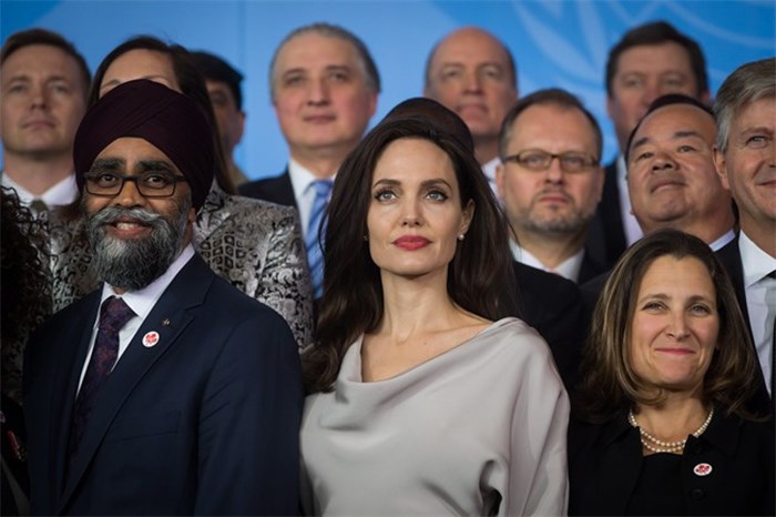  UNHCR Special Envoy Angelina Jolie, centre, stands with Defence Minister Harjit Sajjan, left, and Minister of Foreign Affairs Chrystia Freeland during the family photo with delegates at the 2017 United Nations Peacekeeping Defence Ministerial conference in Vancouver, B.C., on Wednesday November 15, 2017. THE CANADIAN PRESS/Darryl Dyck