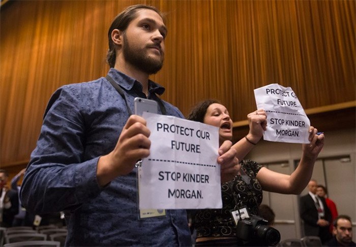  Protesters opposed to the Kinder Morgan Trans Mountain Pipeline expansion interrupt Prime Minister Justin Trudeau's news conference during the 2017 United Nations Peacekeeping Defence Ministerial conference in Vancouver, B.C., on Wednesday November 15, 2017. THE CANADIAN PRESS/Darryl Dyck