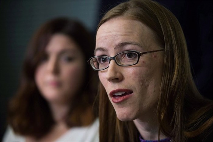  Former University of British Columbia students Glynnis Kirchmeier and Caitlin Cunningham, back, hold a news conference at the university in Vancouver, B.C., on Sunday, November 22, 2015 regarding the university's response to alleged sexual assaults by a former student who was expelled recently. The University of British Columbia has denied mishandling sexual assault reports in documents filed with the province's human rights tribunal. THE CANADIAN PRESS/Darryl Dyck