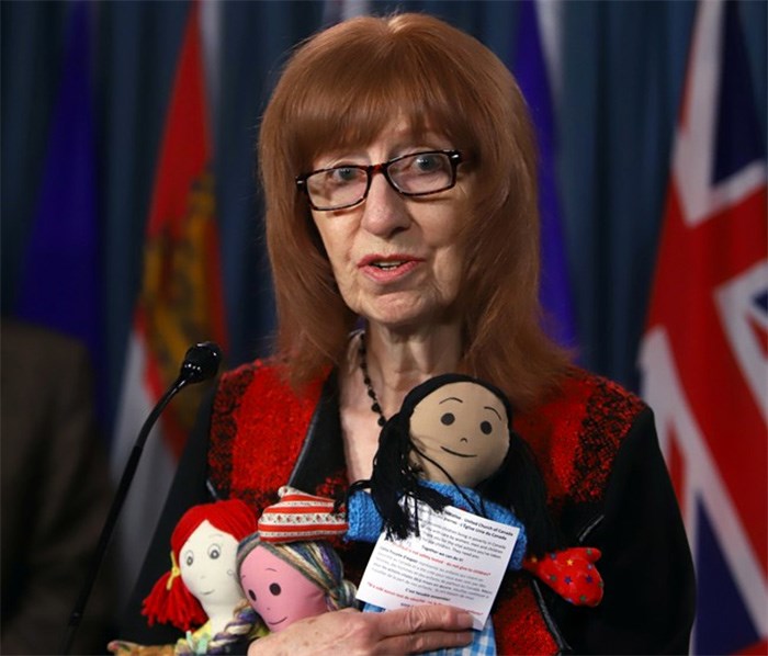  Linda Woods with Bread Not Stones and Child Poverty in Canada partnered with campaign 2000 against child poverty holds rag dolls of hope during a news conference on Parliament Hill in Ottawa on Tuesday November 21, 2017. Dolls will be presented to members of Parliament and Senators. THE CANADIAN PRESS/Fred Chartrand