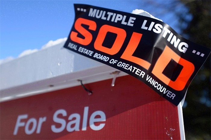  A real estate sold sign is shown outside a house in Vancouver, Tuesday, Jan.3, 2017. THE CANADIAN PRESS/Jonathan Hayward