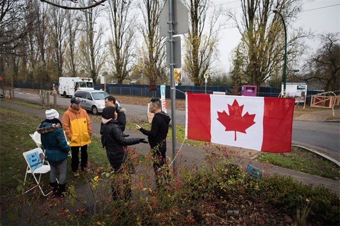  Protesting residents gather across the street from the site where temporary modular housing will be constructed to house homeless people, in Vancouver, B.C., on Thursday December 7, 2017. The City of Vancouver was granted an injunction earlier this week from the Supreme Court of B.C. against protesters who were preventing work crews from accessing the site in the neighbourhood of Marpole. THE CANADIAN PRESS/Darryl Dyck