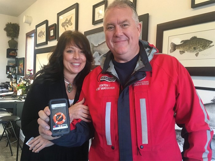  Mya DeRyan with Ian Grantham of the Royal Canadian Marine Search and Rescue, and a photo of the life ring that helped Grantham and his crew spot DeRyan in the ocean. On Oct. 30, DeRyan jumped from the B.C. Ferries vessel Queen of Cowichan. photo Katie DeRosa/Times Colonist