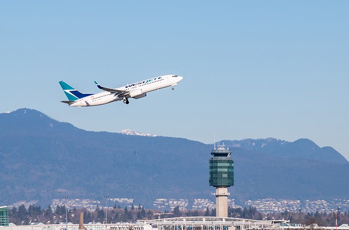  A WestJet plan takes off from YVR. Photo Shutterstock