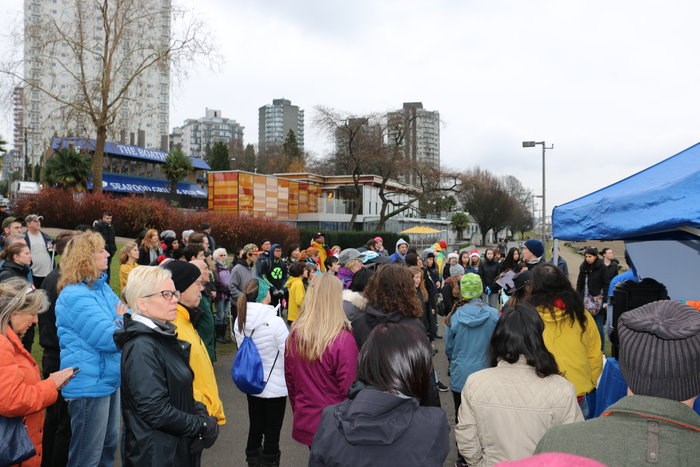  Volunteers gathered for instructions before dispersing for the English Bay beach cleanup/Duncan Anderson