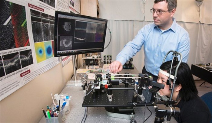  Simon Fraser University engineering science Prof. Marinko Sarunic demonstrates an early prototype of a scanner to diagnose eye diseases and prevent vision loss in this undated handout photo. THE CANADIAN PRESS/HO, Simon Fraser University