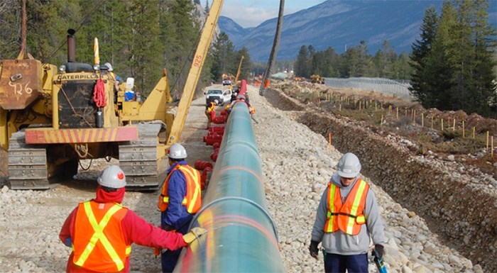  Kinder Morgan says it stands to lose millions of dollars if its in-service date is pushed back.