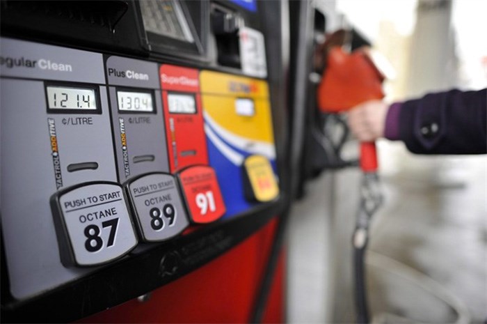  A motorist reaches for the pump at a gas station in Toronto on Thursday, February 24, 2011. THE CANADIAN PRESS/Patrick Dell