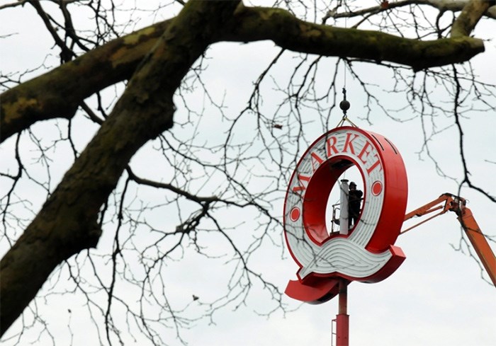  Crews prepare to install the next generation Q sign at North Vancouver's Lonsdale Quay. photo Mike Wakefield, North Shore News