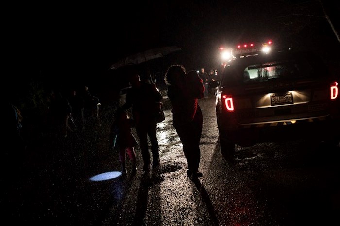  Tofino residents and visitors leave the community centre after the tsunami warning ends, on Tuesday, Jan. 23, 2018. A tsunami warning issued for coastal British Columbia was cancelled Tuesday morning after people living along parts of the province's coast evacuated to higher ground when a powerful earthquake struck off Alaska. THE CANADIAN PRESS/Melissa Renwick