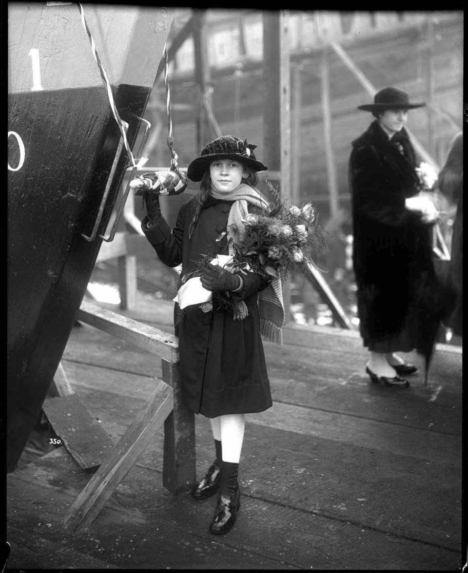  Miss Betty Brown launching 'Mabel Brown' at Wallace Shipyard in North Vancouver, in January 1917. VPL 20099.