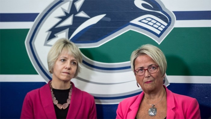 Incoming provincial health officer, Dr. Bonnie Henry, left, and British Columbia Minister of Mental Health and Addictions Judy Darcy listen during a news conference where the provincial government and the Vancouver Canucks NHL hockey team announced a joint campaign to combat stigma around substance abuse, in Vancouver, B.C., on Monday January 29, 2018. (Darryl Dyck/THE CANADIAN PRESS)