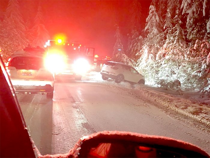  Tow trucks and first responders help pull 10 vehicles from the ditch on Cypress Bowl Road Friday evening. Photo supplied, @AnninTO