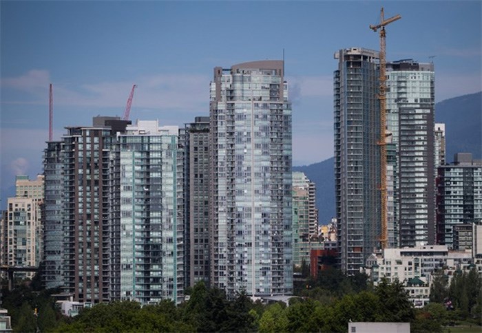  Condo towers, including one under construction, right, are seen in downtown Vancouver, B.C., on August 15, 2017. Rising rental costs, evictions and a scarcity of units in Vancouver's densely populated West End were among the reasons for Gail Harmer's decision to join a group that is taking a new approach to advocating for the rights and protection of tenants. The Vancouver Tenants Union formed last spring in response to a growing number of renters who say they fear eviction or being priced out of their homes and neighbourhoods. The group's membership has grown to nearly 1,000 people across the city. THE CANADIAN PRESS/Darryl Dyck