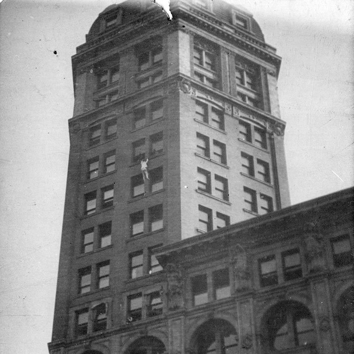  Harry Gardiner climbing the World Building. Vancouver Archives Item: Bu P734