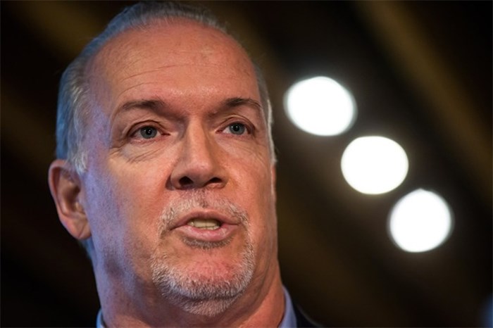  Premier John Horgan announces changes to the province's minimum wage, at a coffee shop in North Vancouver, B.C., on Thursday February 8, 2018. THE CANADIAN PRESS/Darryl Dyck