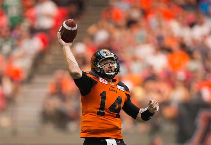  B.C. Lions' quarterback Travis Lulay passes against the Saskatchewan Roughriders during the first half of a CFL football game in Vancouver on August 5, 2017. Quarterback Travis Lulay says he's relieved to sign a one-year deal with the B.C. Lions but isn't sure if he will have recovered from off-season knee surgery in time for the start of training camp. 