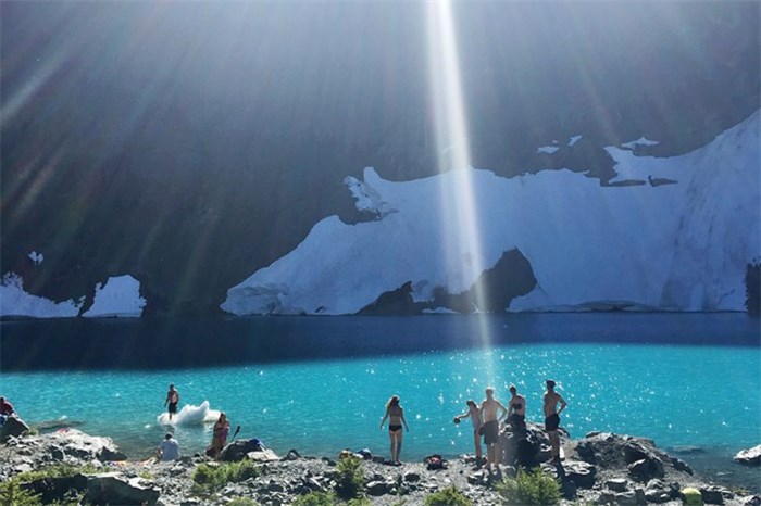  Hikers cool off in the icy waters of British Columbia's Berg Lake in this September 2017 photo. Cradled below towering mountains at the centre of Vancouver Island is a lake whose name tells the landscape's history. Landslide Lake caught the face of one the Island's tallest mountains when a magnitude-7.3 earthquake shook it loose in 1946. THE CANADIAN PRESS/Amy Smart