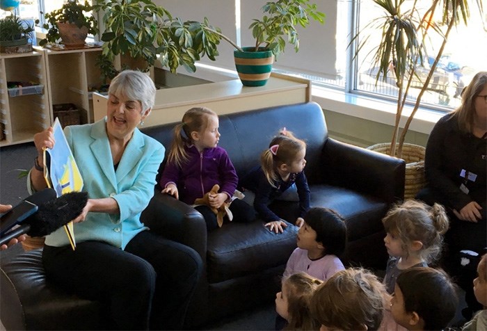  Finance Minister Carole James reads Pete the Cat to youngsters at the YMCA-YWCA Victoria on Broughton Street this morning.