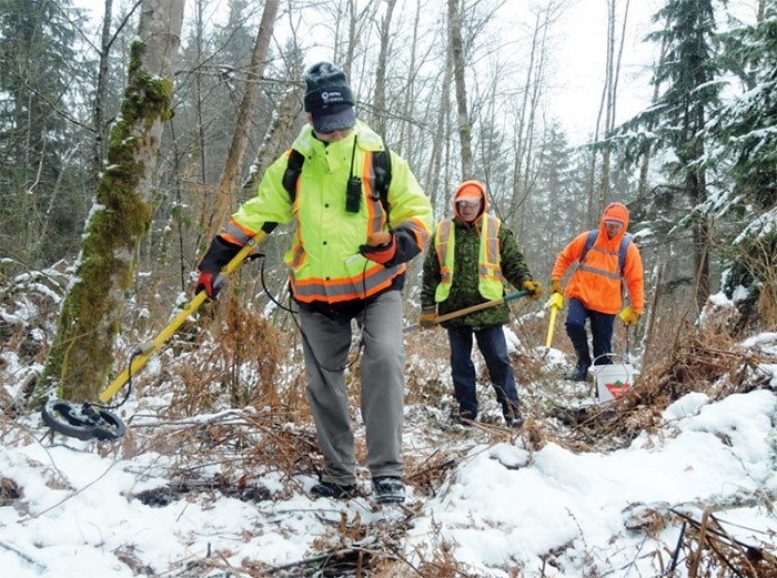  Explosives technician Bob Canning leads a survey crew equipped with metal detectors through the former Blair Rifle Range lands in Seymour. The Department of National Defence is looking to make sure there aren’t any grenades or mortar shells left behind when the range was in use by the military. photo Mike Wakefield, North Shore News