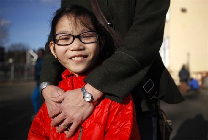  Isabelle Smit, 10, is photographed with her mother Kristen Lundgren in Esquimalt, B.C., on Tuesday, February 20, 2018. Through an online video the mother and daughter are hoping to find Isabelle's birth parents or relatives. THE CANADIAN PRESS/Chad Hipolito