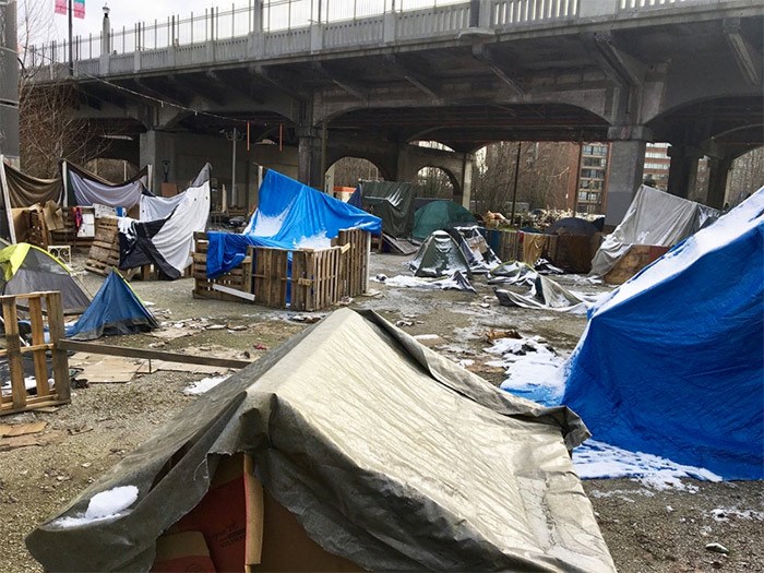  What looked like an emerging tent city for homeless people under the south end of the Burrard Bridge was actually a set for a Netflix series. The tents and tarps were supposed to be a refugee camp.