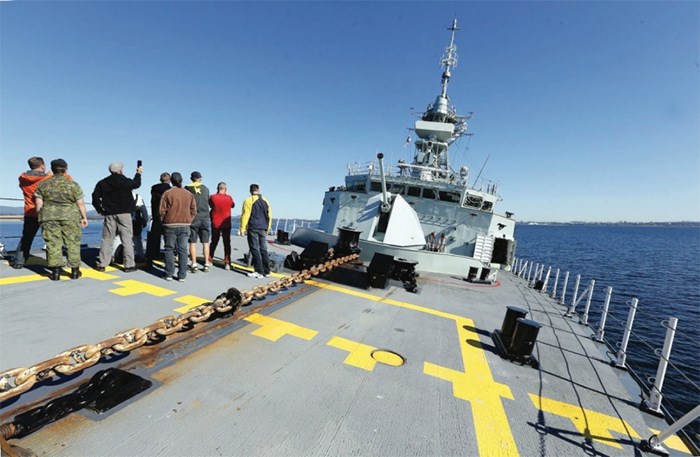  Visitors tour the deck of HMCS Calgary.   Photograph By BRUCE STOTESBURY, Times Colonist