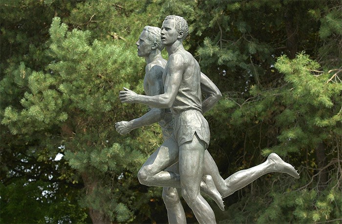  When Empire Stadium was torn down in the 1990s, the statue was saved, and relocated to the corner of Renfrew and Hastings (shown here) for 20 years. In 2015, it was moved to the north side of the new Empire Fields, with the massive North Shore mountains looming in the background, exactly where the feat took place 64 years ago. Photo Dan Toulgoet