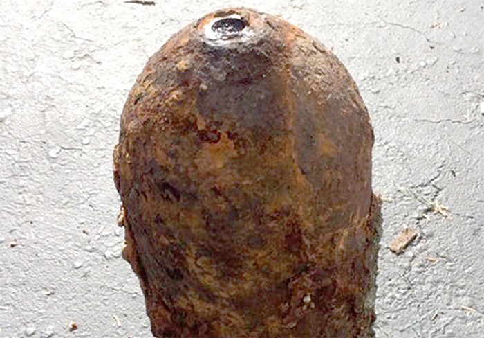  This corroded object, possibly an old military ordnance, was found buried on a Deep Cove property Monday afternoon. photo supplied North Vancouver RCMP