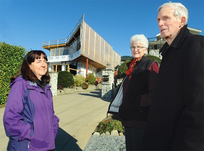 Residents Heather Sneddon, Lois Grant and Ken Bryden say a house being built near to them on Lawson Avenue is out of character with their West Vancouver neighbourhood. photo Cindy Goodman, North Shore News