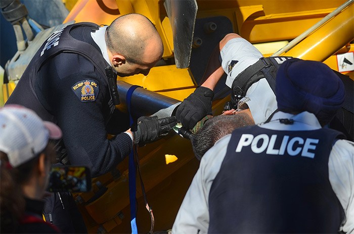  Burnaby RCMP trying to figure out the metal contraption. - Cornelia Naylor