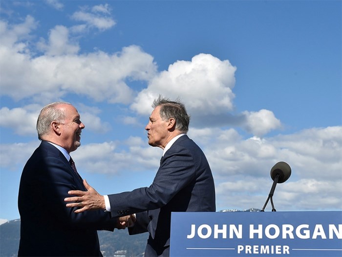  Premier John Horgan joined Washington State Gov. Jay Inslee Friday on a patio outside the premier’s Vancouver office to announce a $300,000 contribution to help further study the concept of a high speed train service from Vancouver to Seattle and Portland. Photo Dan Toulgoet