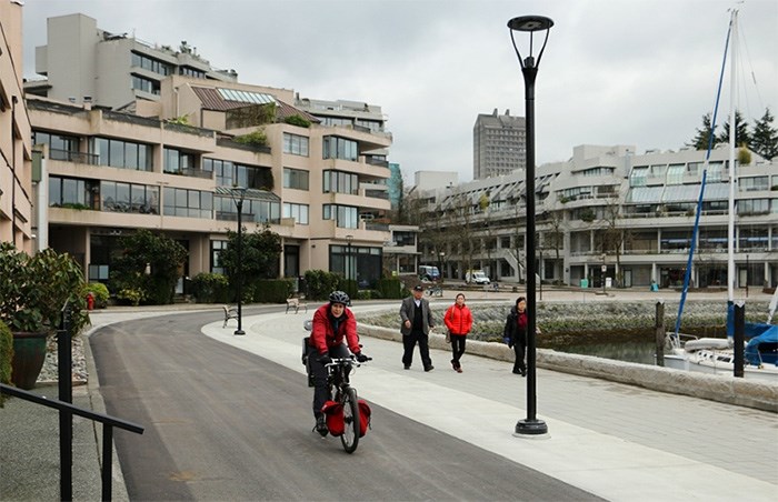  Cyclists and pedestrians are back on the Seawall along South False Creek between Stamps Landing and Granville Island. Photo Saša Laki?