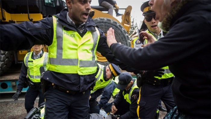  Numerous protesters who blockaded an entrance, defying a court order, were arrested earlier Monday while protesting the Kinder Morgan Trans Mountain pipeline expansion. (Darryl Dyck/Canadian Press)
