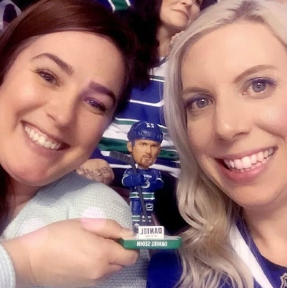  Nikki and Myra at the game with a familiar bobblehead