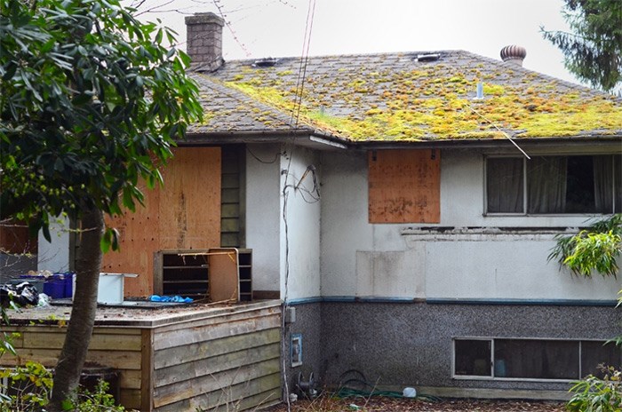  A Sumas Street house has been boarded up after a major fire Friday.   Photograph By Cornelia Naylor