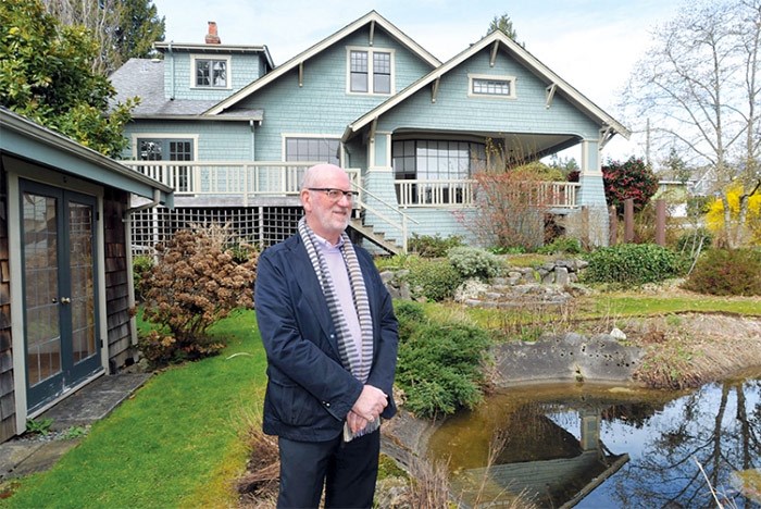  Developer Michael Geller stands outside a heritage home he owns in West Vancouver. Geller worries he could be hit by the speculation tax while he awaits permits. PHOTO PAUL MCGRATH, North Shore News