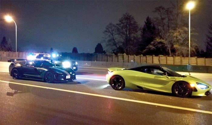  Police prepare to tow a $312,000 McLaren and a 2015 Corvette on the Upper Levels Highway early Wednesday morning. photo supplied, West Vancouver Police Department