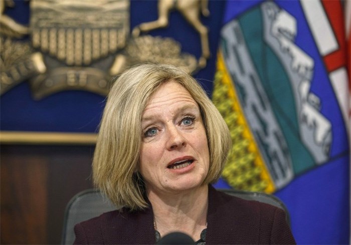  Alberta Premier Rachel Notley talks to cabinet members about the Kinder Morgan pipeline expansion, in Edmonton on Monday, April 9, 2018. Notley says the federal government has convinced her that, in her words, 