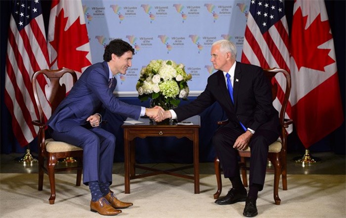  Prime Minister Justin Trudeau, left, meets with United States Vice President Mike Pence at the Summit of the Americas in Lima, Peru on Saturday, April 14, 2018. THE CANADIAN PRESS/Sean Kilpatrick