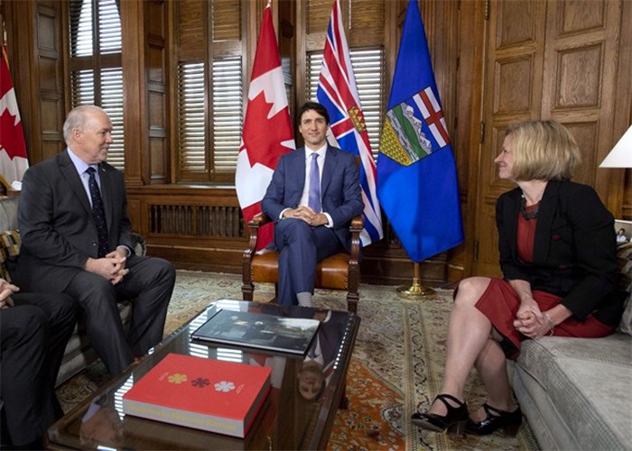  Prime Minister Justin Trudeau, B.C. Premier John Horgan, left, and Alberta Premier Rachel Notley, sit in Trudeau's office on Parliament Hill for a meeting on the deadlock over Kinder Morgan's Trans Mountain pipeline expansion, in Ottawa on Sunday, April 15, 2018. THE CANADIAN PRESS/Justin Tang