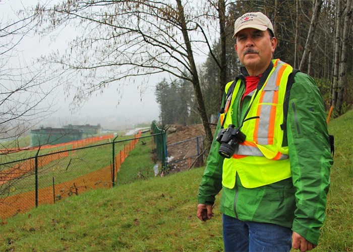  Streamkeeper John Preissl stands north east of Trans Mountain's terminal in Burnaby. Excavation at the site behind him may have led to a sediment spill downstream in Silver Creek.   Photograph By Lauren Boothby