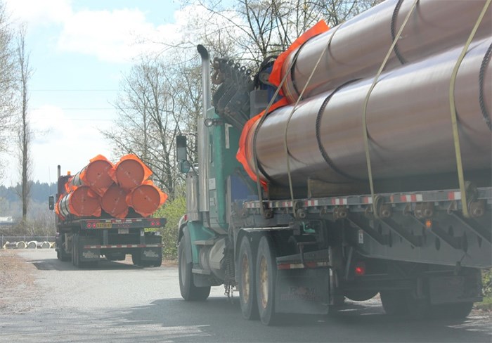  Truckloads of pipes arrive at Kinder Morgan’s staging facility in New Westminster on April 12. Additional pipe shipments were spotted Monday.   Photograph By Contributed, Peter McCartney