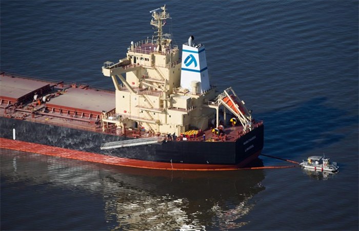  A spill response boat monitors a boom placed around the bulk carrier cargo ship Marathassa after a bunker fuel spill on Burrard Inlet in Vancouver, B.C., on Thursday April 9, 2015. Despite 