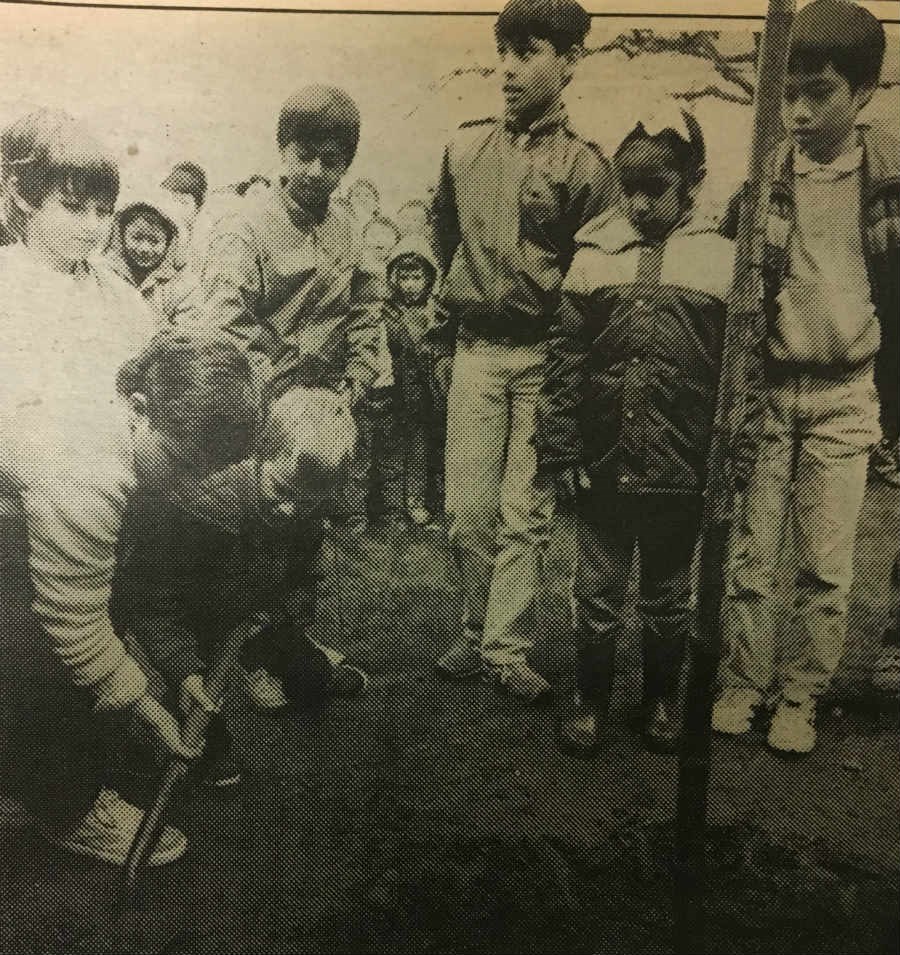  Students at John Norquay School, 4710 Slocan Street in East Vancouver, stood out in the rain as class reps planted a maple tree in commemoration of Vancouver's 100th birthday Centennial celebrations last week. Photo Ed Olson.